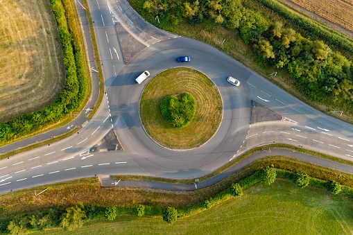 Directly above a roundabout in warm evening sunlight.