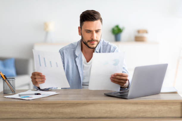 an unemployed man looking a paperworks