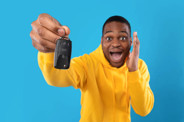 istock Emotional African Man Showing Automobile Key And Shouting, Blue Background 1342063503
