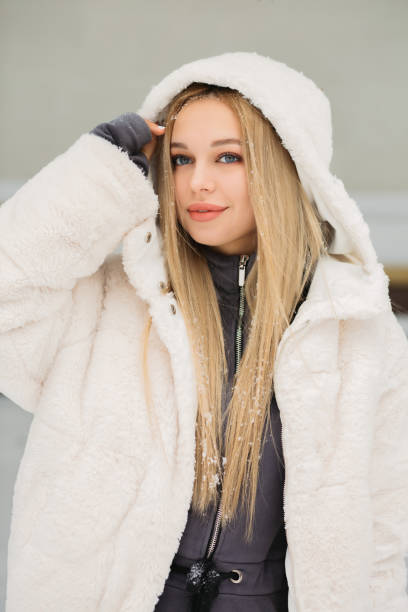 istock Beautiful lady posing in the winter park 1342064199