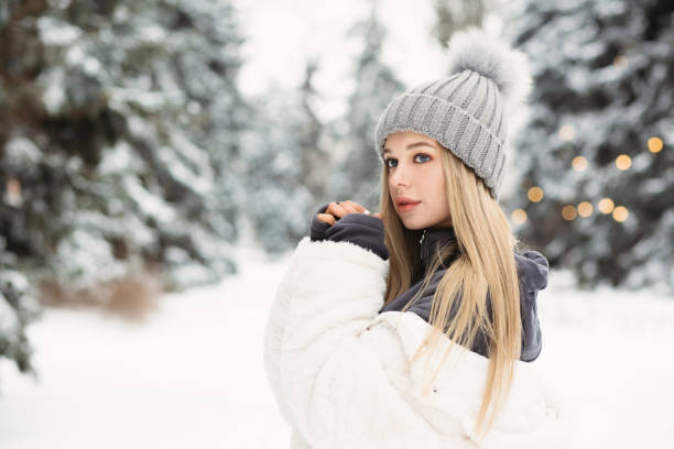 istock Adorable lady walking in the winter forest 1342064208