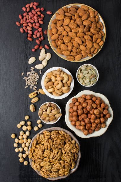 istock Different types of nuts in composition isolated on white in studio 1342064282