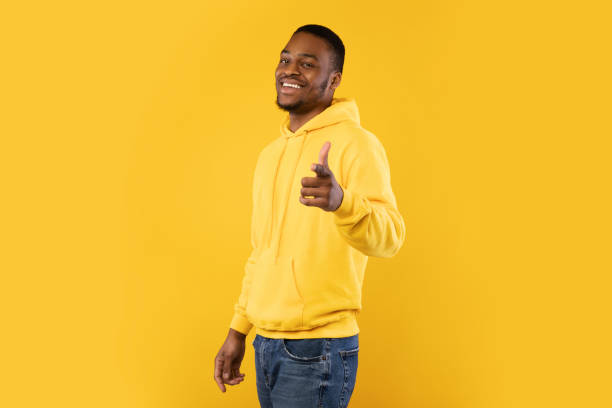 istock Smiling Black Man Pointing Finger At Camera Over Yellow Background 1342066033