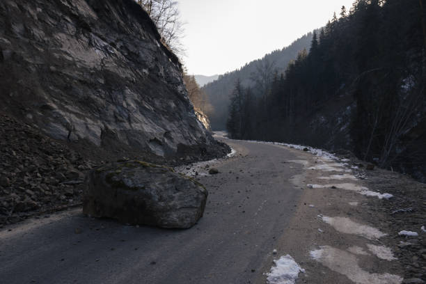 istock Rocks fallen on the road. Natural disasters. 1342067206