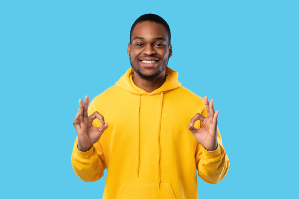 istock African Guy Gesturing Okay Sign With Both Hands, Blue Background 1342067294