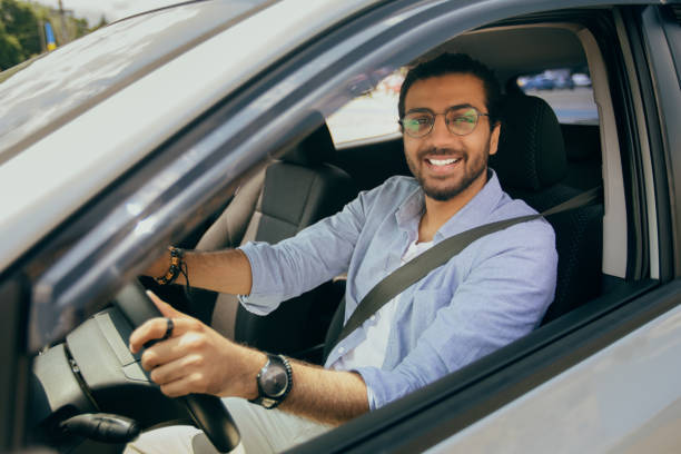 istock Stylish middle-eastern man driving nice auto, closeup photo 1342068644