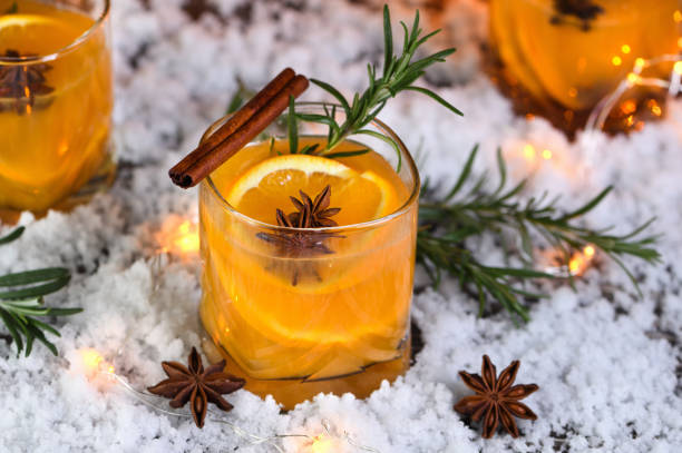 Negroni cocktail. Bourbon with cinnamon with oranges juice and star anise. The perfect cozy cocktail for chilly December evenings. stock photo