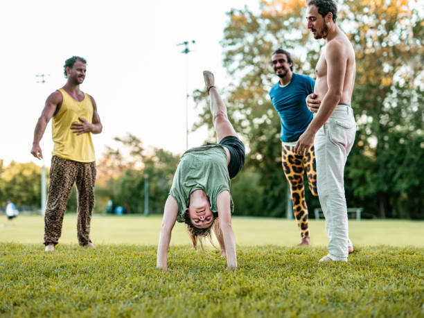 istock People practising Acro Yoga in the park 1342071782