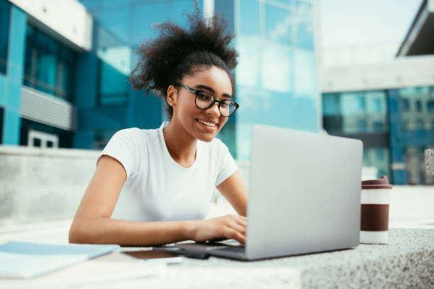 istock Successful Black Student Girl Using Laptop Learning Online Outdoor 1342075232