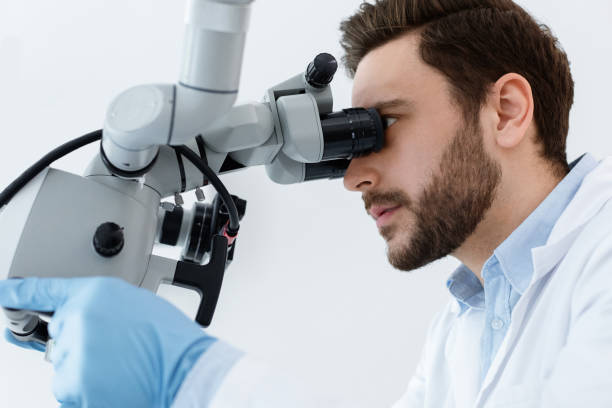 istock Male dentist doctor using newest equipment for treating 1342077046