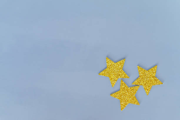istock golden stars on blue background, greeting card template 1342077218