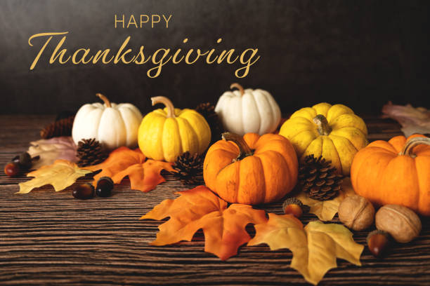 istock Happy Thanksgiving Day with pumpkin and nut on wooden table 1342077430