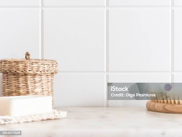 Bath Background Front View With Straw Box Wood Brush For Body And White Soap On White Marble Shelf Stock Photo - Download Image Now