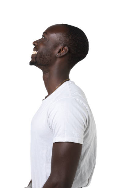 istock African boy in profile smile on a white background looks up. 1342079063