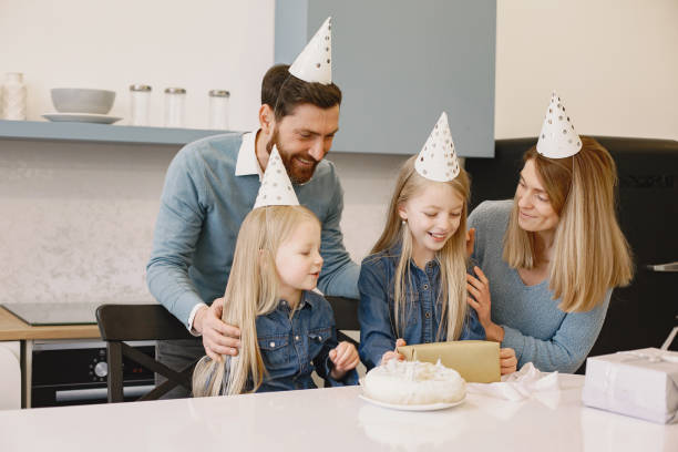 istock Family celebrating birthday in the kitchen 1342080242