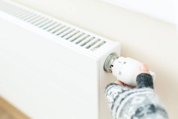 istock White radiator with a thermostat 1342080635