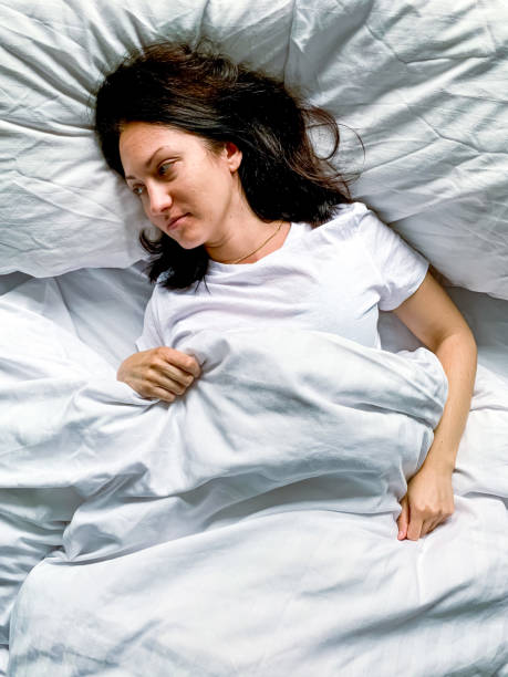 istock Young woman in bed 1342081123
