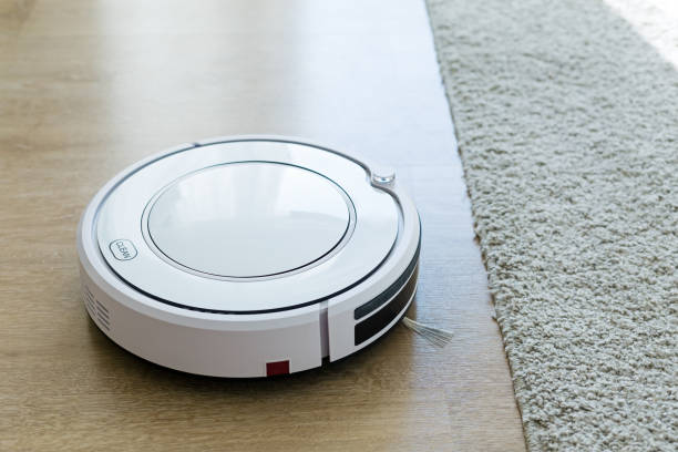 istock Robot vacuum cleaner cleaning floor 1342081700