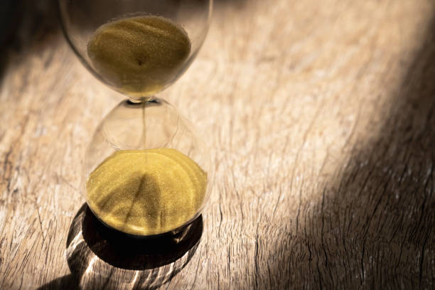 istock Sand clock , Hourglass as time passing on wooden background , Life time concept 1342082284