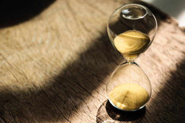 istock Sand clock , Hourglass as time passing on wooden background , Life time concept 1342082301