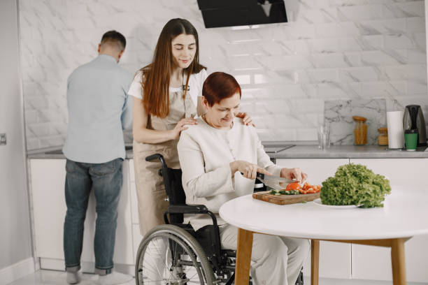 istock Mature disabled woman cutting vegetables in the kitchen 1342082631