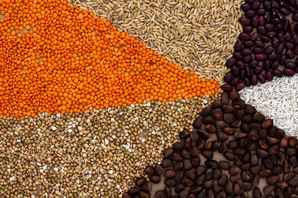 istock Background of triangles lined with various cereals and nuts on a craft paper. 1342084040