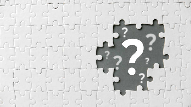 istock Top view of an empty space of jigsaw puzzle fill with question symbol. 1342084127