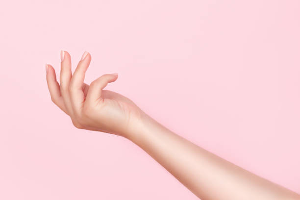 istock Female hand with nude nails 1342086552