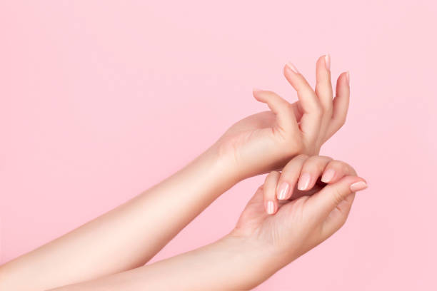 istock Female hands with nude nails 1342086680