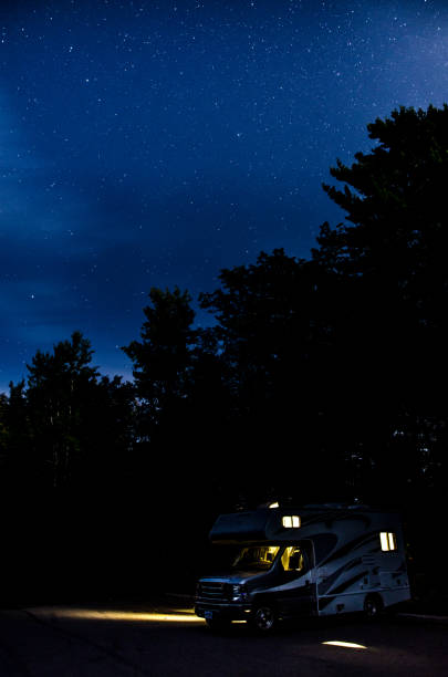 istock Motorhome in a parking during summer night with stars 1342088086