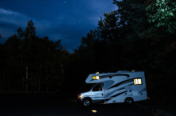 istock Motorhome in a parking during summer night with stars 1342088191