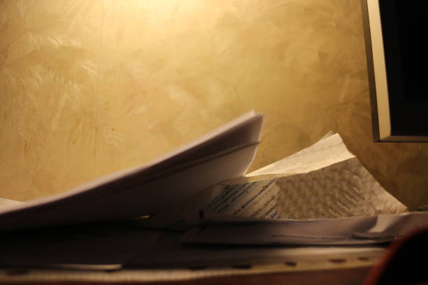istock sheets of white paper in the evening room 1342088668
