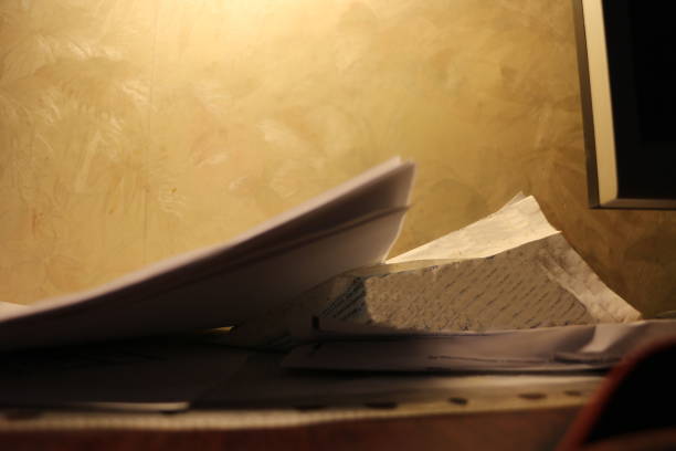 istock sheets of white paper in the evening room 1342088670