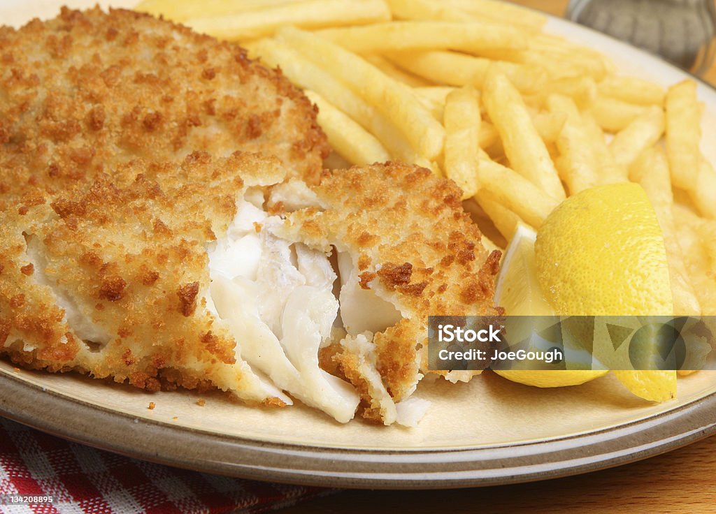 Breaded Fish Fillet & Fries Breaded haddock fillets with crispy fries. Fish Stock Photo