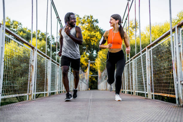 istock Athletic couple running together 1342090831