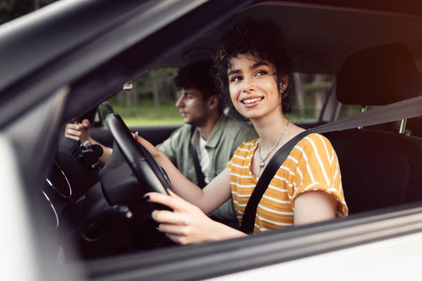 istock Happy young couple navigating with smart phone on a road trip 1342093160