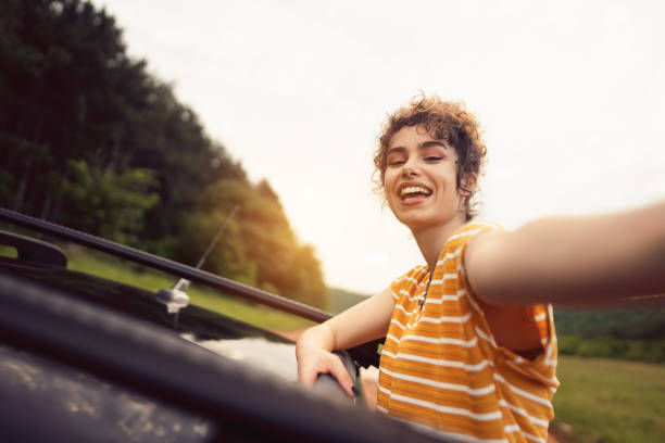 istock Young woman enjoying on a road trip 1342093181