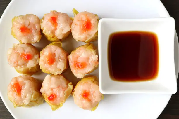 Photo of Top View of Mouthwatering Shrimp and Pork Filled Chinese Steamed Dumplings or Shumai
