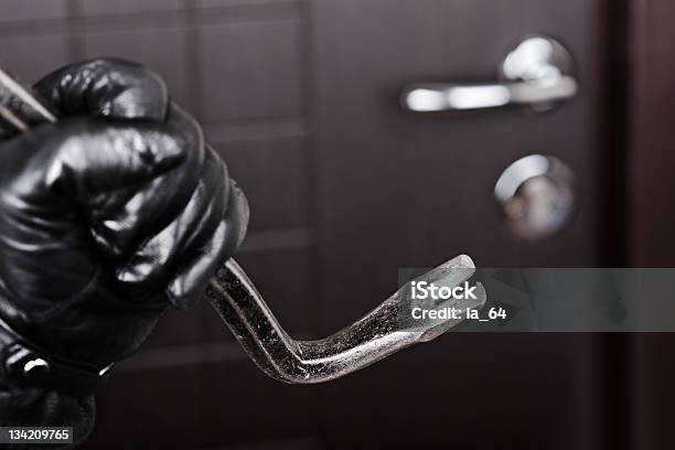 Burglar Hand Holding Crowbar Break Opening Door Stock Photo - Download Image Now - Burglar, Burglary, Door