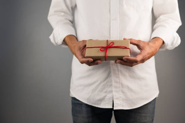 istock Hand holding gift box, new year gift box, Christmas gift box ,copy space. Christmas, hew year, birthday concept. 1342099448