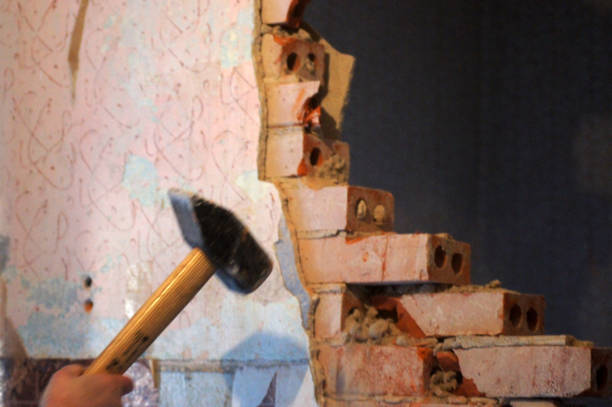 Demolition work of a house wall, breakthrough, wall