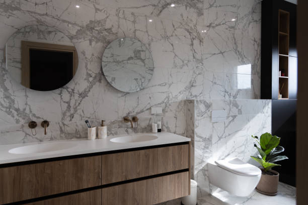 istock Modern bright bathroom with green plant and window 1342100796