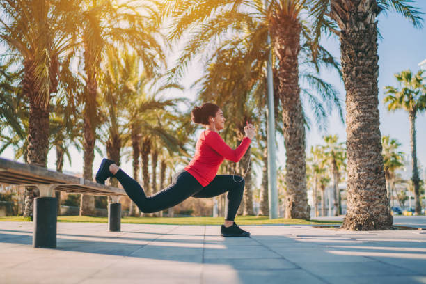 Mixed race woman in Barcelona exercising Bulgarian split squat