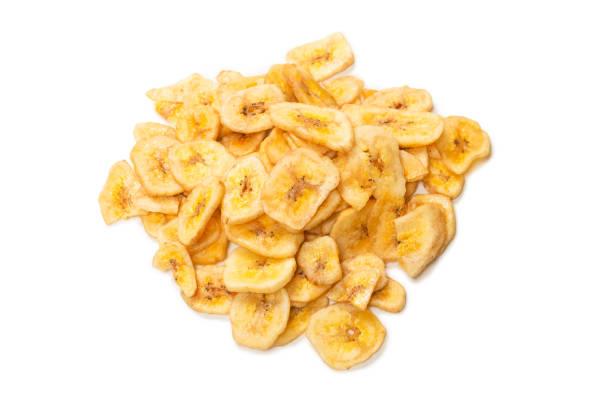 istock Banana chips isolated on a white background. Dehydrated banana. 1342102333