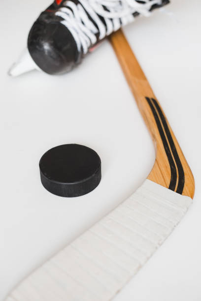 istock Hockey concept - skates stick and puck 1342104231