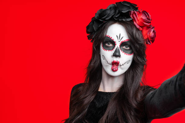 istock Sugar skull makeup on happy Halloween party 1342104512