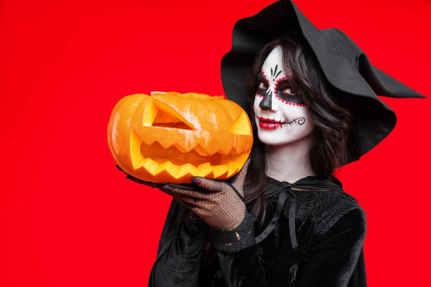 istock Sugar skull makeup on happy Halloween party 1342105606