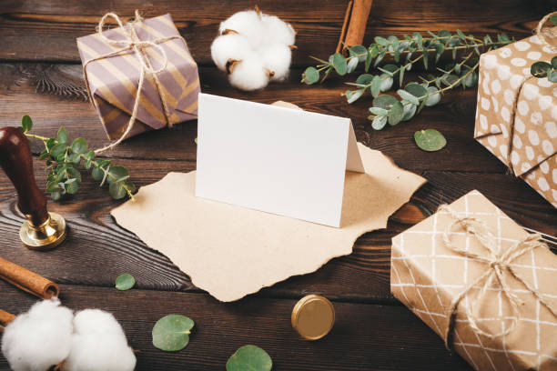 istock Empty letter with a feather on old wooden background decorated with christmas objects 1342106953