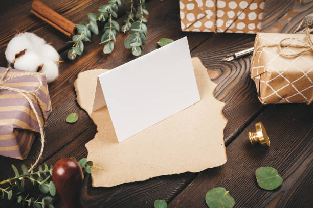 istock Empty letter with a feather on old wooden background decorated with christmas objects 1342108504