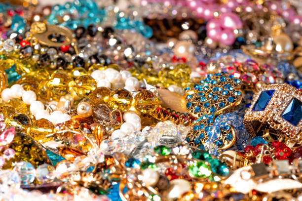 istock necklaces, earrings, bracelets, pearls, beads and various colored gemstones as a background 1342108917
